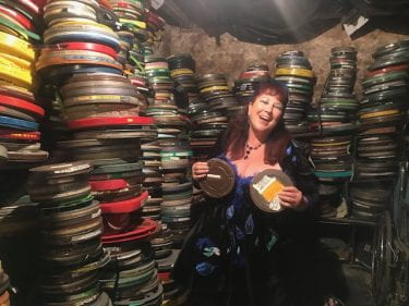 Annie Sprinkle with film canisters photo