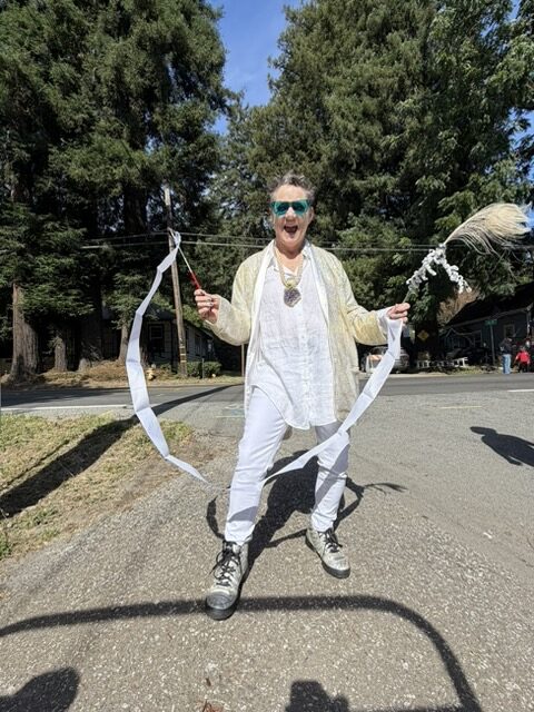 Elizabeth Stephens holding feather streamer