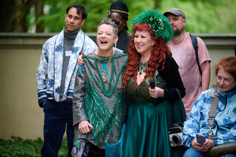 Lenbachhaus Walking Ritual: Beth and Annie wearing green festive costumes